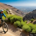 이스라엘에서 할 수 있는 익스트림 스포츠 - A dynamic mountain biking scene in Israel&rsquo;s Judean Mountains featuring a cyclist wearing full protec...